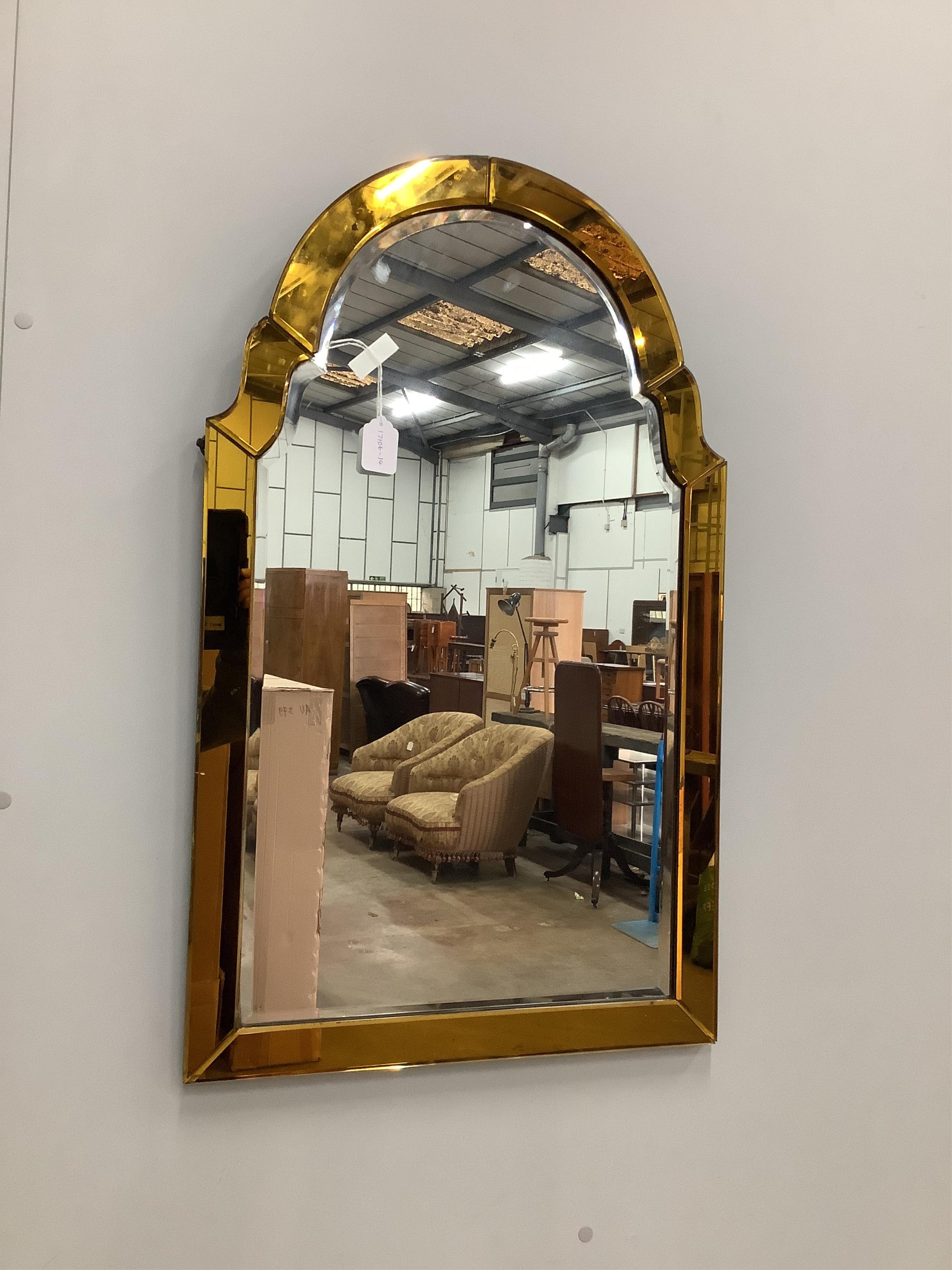 An Art Deco style amber and clear glass wall mirror, width 54cm, height 89cm. Condition - fair